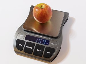 Küchenwaage VOX 2 wiegt einen Apfel